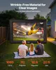 A family is watching a movie on an inflatable screen in their backyard at dusk. Anteprima dell’immagine prodotto