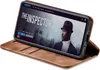 A smartphone in a brown flip case is displayed, showing a movie streaming interface on its screen. Produktbild-Vorschau