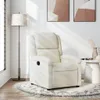 A cream-colored recliner chair is placed on a rug in a well-lit room, next to a floor lamp and a small side table with decorative items. Produktbild-Vorschau