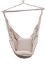 A beige fabric hammock chair with a pillow, suspended from a wooden bar. Produktbild-Vorschau