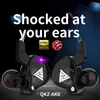 A pair of black in-ear headphones with a white logo and text overlays. Produktbild-Vorschau