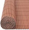A rolled-up privacy screen made of brown slats. Náhled obrázku produktu