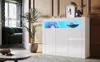 A white high-gloss sideboard with LED lighting is displayed in a modern living room setting. Podgląd zdjęcia produktu