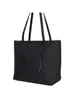 A black Armani Exchange shopper tote bag is shown against a white background. Podgląd zdjęcia produktu