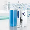 A bathroom counter with a sink and faucet in the background, and an Oral-B cleaning system with a water flosser and toothbrush in the foreground. Náhled obrázku produktu