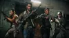 Four people in tactical gear holding weapons in a dimly lit industrial setting. Produktbild-Vorschau