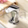 A chrome faucet is shown on a marble countertop next to a folded towel and a pink flower. Produktbild-Vorschau