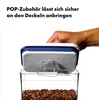 A hand is shown attaching a blue and white lid to a clear food storage container filled with coffee beans. Náhľad obrázku produktu