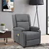 A gray massage recliner chair is shown in a living room setting, next to a side table with a plant and a cup of coffee. Anteprima dell’immagine prodotto