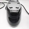 A close-up, top-down view of a black and gray steam iron on a white background. Produktbild-Vorschau