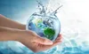 Hands holding a globe full of water with a splash coming out of it. Náhľad obrázku produktu
