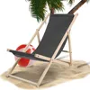 A beach chair and beach ball on sand with a palm tree overhead. Produktbild-Vorschau