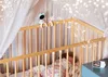 A baby sleeping in a crib with a baby monitor and musical notes overlay. Náhľad obrázku produktu