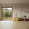 A modern living room with a large window overlooking a garden, featuring a decorative column, a floor lamp, and a low bench with a plant. Produktbild-Vorschau