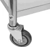 A close-up of a caster wheel and leg of a stainless steel serving cart. Produktbild-Vorschau