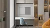 A modern desk setup with a chair and shelving unit. Produktbild-Vorschau
