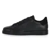 A side view of a black leather sneaker against a white background. Voir les images du produit