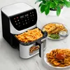 A TESLA AirCook Q70 XXL WiFi Pro digital air fryer filled with french fries, with plates of prepared food nearby. Náhľad obrázku produktu