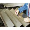 A person is marking metal sheets with a marker. Anteprima dell’immagine prodotto