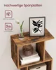 A close-up view of a rustic-style bookshelf with decorative items and framed art. Produktbild-Vorschau