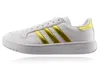 A white Adidas shoe with gold stripes against a white background. Produktbild-Vorschau