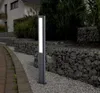 A modern outdoor lamp is placed on a gravel path next to a gabion wall. Anteprima dell’immagine prodotto