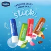 Four Vaseline lip balm sticks are displayed diagonally against a light blue background with decorative elements like wings and bubbles. Produktbild-Vorschau