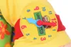 Close-up of a stuffed toy's arm with a clock face on it. Produktbild-Vorschau