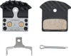 A set of bicycle brake pads and related hardware, laid out against a white background. Produktbild-Vorschau