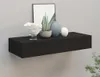 A black floating shelf mounted on a light gray wall, decorated with a framed picture, a potted plant, and two vases. Produktbild-Vorschau