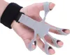 A hand wearing a gray finger exerciser with a black wrist strap. Náhled obrázku produktu