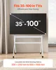 A TV stand with a TV mounted on it, in a room with a window view of the sea. Anteprima dell’immagine prodotto