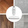 A collage showing a steam mop in the center, surrounded by different floor types: herringbone wood, carpet, wood planks, and tile. Produktbild-Vorschau