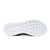 The sole of a black and white shoe is shown against a white background. Produktbild-Vorschau