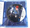 A PlayStation 5 game disc for Stellar Blade is shown inside its blue plastic case. Produktbild-Vorschau
