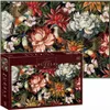A puzzle box with a picture of a puzzle featuring birds and flowers. Produktbild-Vorschau