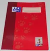 A red notebook with paw print designs and branding. Náhled obrázku produktu