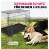 A woman is hugging a dog on a grassy lawn next to a dog crate. Náhled obrázku produktu