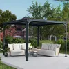 An outdoor patio area with a metal pergola, two sofas, and a coffee table. Podgląd zdjęcia produktu
