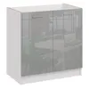 A two-door kitchen cabinet with a glossy gray finish and a white countertop, shown in a studio setting with a blurred background of an office or meeting room. Náhľad obrázku produktu