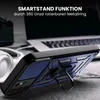A close-up of a blue and black phone case with a metal ring stand, placed on a surface with a laptop and headphones in the background. Produktbild-Vorschau