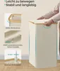 A person is shown closing the lid of a laundry basket, with close-up images of its features. Produktbild-Vorschau