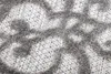 A close-up view of a textured rug with a geometric pattern. Produktbild-Vorschau