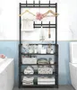 A black metal standing shelf unit with multiple shelves and hooks, used in a bathroom setting to store towels, toiletries, and accessories. Produktbild-Vorschau