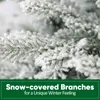 A close-up of snow-covered artificial Christmas tree branches with a green banner at the bottom containing text. Podgląd zdjęcia produktu