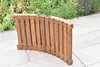 A wooden garden lounger is shown folded on a paved patio with plants in the background. Náhled obrázku produktu