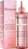 A product shot of a Kérastase hair treatment bottle and its packaging, set against a white background. Produktbild-Vorschau