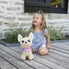 A young girl sits on a wooden deck next to a stuffed dog. Anteprima dell’immagine prodotto
