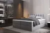 A modern bedroom with a large boxspring bed. Produktbild-Vorschau