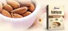 A bowl of almonds next to a box of Falcone Cantucci Mandorle almond cookies. Voir les images du produit